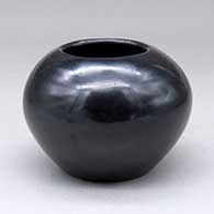 Click for a larger view A plain polished black jar
 by Maria Martinez of San Ildefonso