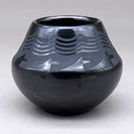 Click for a larger view A small black on black jar decorated with a geometric design above the shoulder
 by Maria Martinez of San Ildefonso