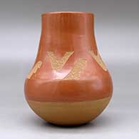 A red with a buff base, decorated with a sgraffito avanyu and geometric design plus an inlaid stone, click or tap to see a larger version