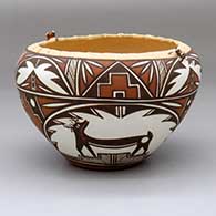 A polychrome bowl with tiny frog appliques on the corrugated rim and inside with a three-panel deer-with-heart-line and geometric design around the body
 by Noreen Simplicio of Zuni
