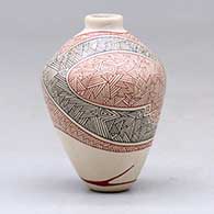 A miniature polychrome jar decorated with a fineline geometric design, click or tap to see a larger version