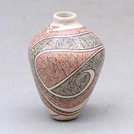 A miniature polychrome jar decorated with a fineline geometric design
 by Carla Martinez of Mata Ortiz and Casas Grandes