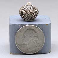 Miniature black-on-white seed pot with a four-panel fine line and geometric design, click or tap to see a larger version