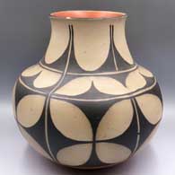 Polychrome jar with a tall flared neck and a black-and-white geometric design
 by Hilda Coriz of Santo Domingo