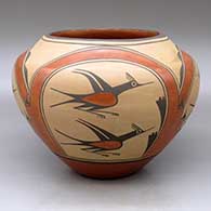 A high-shouldered polychrome jar decorated with a four-panel roadrunner, rainbow, flower, cloud and geometric design
 by Eleanor Pino Griego of Zia