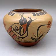 A high-shouldered polychrome jar decorated with a three-panel roadrunner, flower, cloud and geometric design
 by Eleanor Pino Griego of Zia