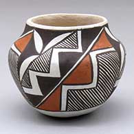 A small polychrome jar decorated with a three-panel fine line and geometric design
 by Evelyn Cheromiah of Laguna