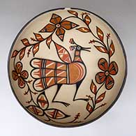 A polychrome dough bowl decorated inside with a bird, plant and flower design, and decorated outside with an eight-panel bird and geometric design
 by Warren Coriz of Santo Domingo