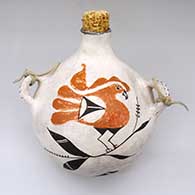 A polychrome canteen decorated with a parrot, flower, cloud, leaf and geometric design
 by Unknown of Acoma