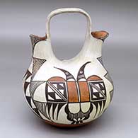 A polychrome wedding vase decorated with a four-panel thunderbird, rain cloud and geometric design
 by Unknown of Acoma