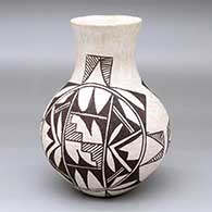 A black-on-white water jar decorated with a two-panel geometric design
 by Unknown of Acoma