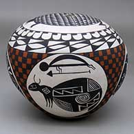 A polychrome seed pot with a turtle on the top and four Mimbres medallions in a checkerboard and geometric design around the body
 by Emmalita Chino of Acoma