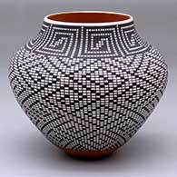 A polychrome jar decorated with a black-on-white geometric design
 by Frederica Antonio of Acoma