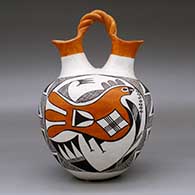 A polychrome wedding vase with a twisted bridge and decorated with a parrot, plant, fine line and geometric design, click or tap to see a larger version