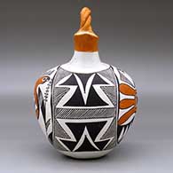 A polychrome wedding vase with a twisted bridge and decorated with a parrot, plant, fine line and geometric design, click or tap to see a larger version