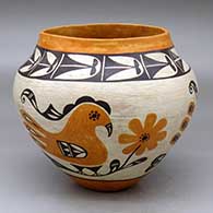 A polychrome jar decorated with a three-panel parrot, flower, rainbow and geometric design
 by Unknown of Acoma