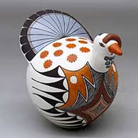 A polychrome turkey figure decorated with a fine line, bird element and geometric design
 by Lilly M Salvador of Acoma