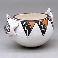 A small polychrome bowl with turtle applique handles and a lightning bolt, spiral and geometric design
 by Dolores Lewis of Acoma