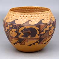 A polychrome jar decorated with an eight panel bear with heart line and geometric design below a band of corrugation above the shoulder
 by Goldie Hayah of Acoma