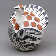 A polychrome turkey figure decorated with a feather, fineline and geometric design
 by Eva Histia of Acoma