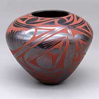 A red-on-graphite-black jar decorated with bands of geometric design
 by Efrain Lucero of Mata Ortiz and Casas Grandes