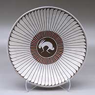 A shallow polychrome bowl decorated with a Mimbres rabbit, feather and geometric design
 by Humberto Ponce of Mata Ortiz and Casas Grandes