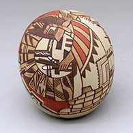 A polychrome seed pot decorated with a lightly-carved, sgraffito-and-painted katsina, dancer, pueblo wall, bird elements, ears of corn and rock art geometric design
 by Lawrence Namoki of Hopi