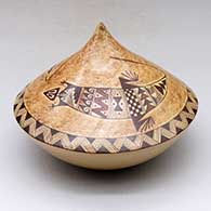 A polychrome peaked seed pot decorated above the shoulder with a two-panel lizard and geometric design
 by Nona Naha of Hopi