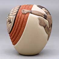 A polychrome seed pot decorated with a carved and painted katsina, sunface, ear of corn and geometric design, click or tap to see a larger version