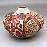 A polychrome jar carved and painted with a corn maiden, corn plant, feather and geometric design
 by Thomas Polacca of Hopi