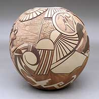 A polychrome seed pot carved and painted with warrior kachinas dancing and praying for the gentle side of life, click or tap to see a larger version