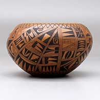 A black on red bowl polished inside and decorated on the outside with a small sherd and geometric design, click or tap to see a larger version