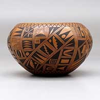 A black on red bowl polished inside and decorated on the outside with a small sherd and geometric design, click or tap to see a larger version