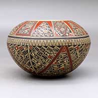 A polychrome bowl, polished inside and decorated on the outside with a small sherd and geometric design, click or tap to see a larger version