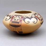A polychrome jar decorated with a four-panel bird element and geometric design
 by Vernida Polacca of Hopi