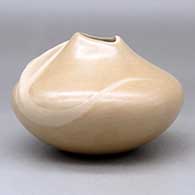 A buff jar with an organic opening and a carved ear of corn applique, click or tap to see a larger version