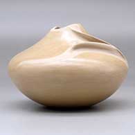 A buff jar with an organic opening and a carved ear of corn applique, click or tap to see a larger version