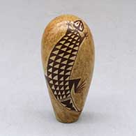 A small polychrome piece decorated with a two panel lizard and geometric design
 by Nona Naha of Hopi