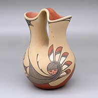 A polychrome wedding vase decorated with a two-panel sun-face, feather, rain and geometric design
 by Laura Gachupin of Jemez