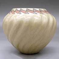 A polychrome ribbed melon jar decorated with a necklace of geometric design around the opening, click or tap to see a larger version