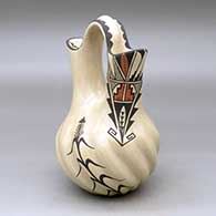 A polychrome wedding vase with a melon base and decorated with a cornstalk and geometric design
 by Juanita Fragua of Jemez