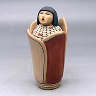 A polychrome Corn Maiden figure
 by Laura Gachupin of Jemez