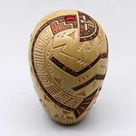 A polychrome seed pot decorated with a sgraffito and painted yeibichai and geometric design with an inlaid stone on top
 by Glendora Fragua of Jemez