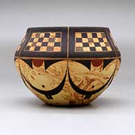 A polychrome mixed clay bowl decorated around the body with a six-panel checkerboard and geometric design, click or tap to see a larger version