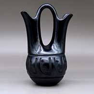 A black wedding vase carved around the body with a geometric design, click or tap to see a larger version