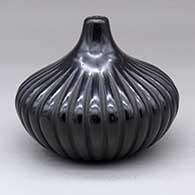 A black squash melon jar with 32 ribs
 by David Baca of Santa Clara