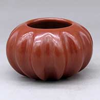 A red melon jar with twelve repousse ribs
 by Helen Shupla of Santa Clara