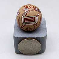 A miniature polychrome seed pot decorated with a three panel deer and geometric design
 by Joseph Lonewolf of Santa Clara