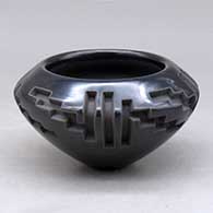 A black bowl carved around the body with a four panel kiva step and geometric design
 by Effie Garcia of Santa Clara