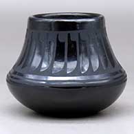 A black on black jar decorated with a ring of feathers design above the shoulder, click or tap to see a larger version